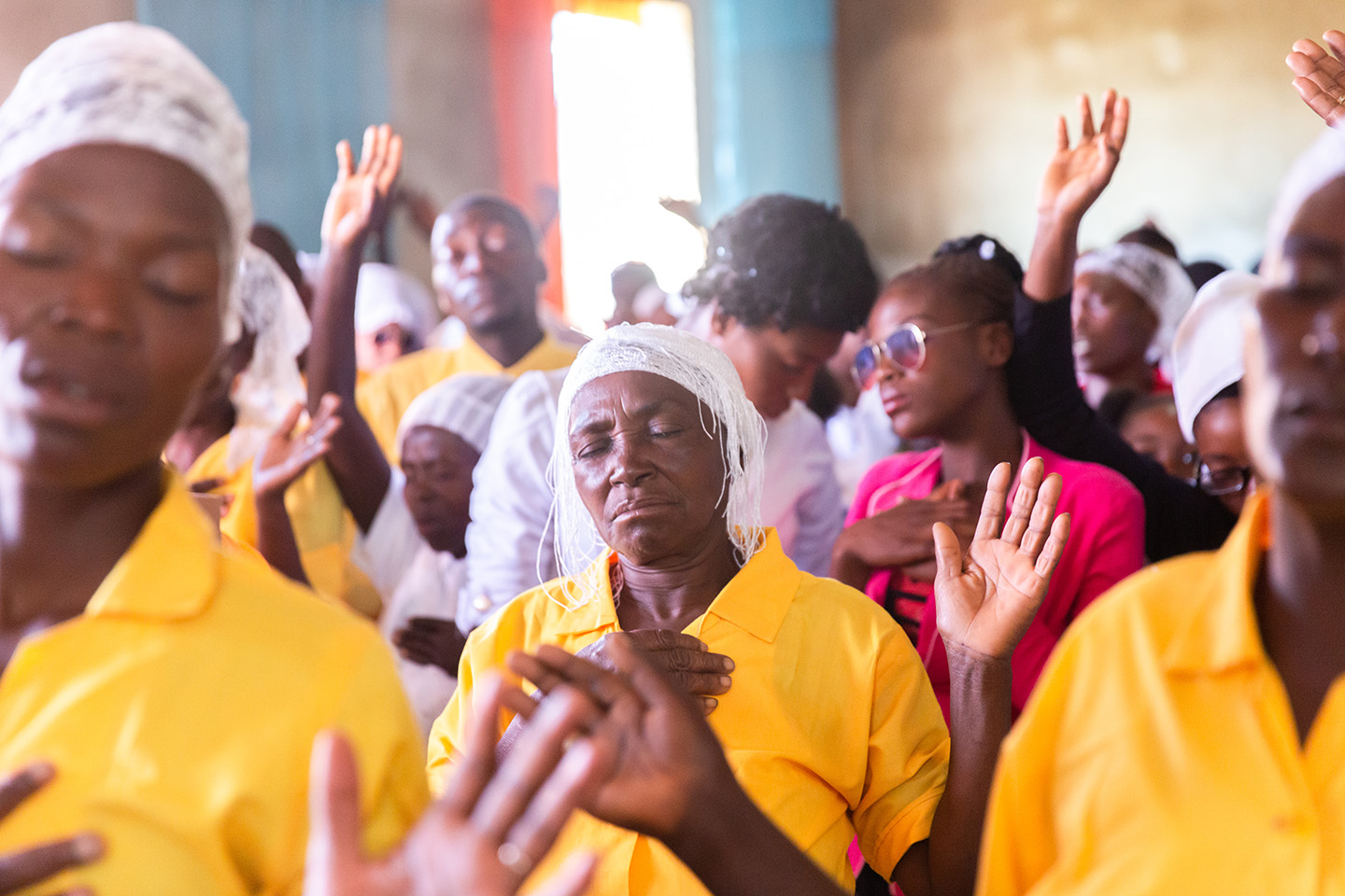 a Sunday service in Haiti with women worshiping